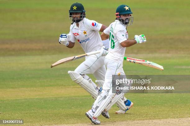 Pakistans Abdullah Shafique and Mohammad Rizwan run between wickets during the final day of play of the first cricket Test match between Sri Lanka...