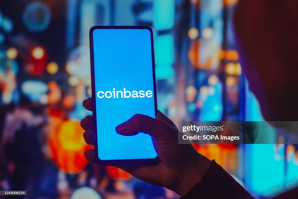 In this photo illustration, the Coinbase logo is displayed...