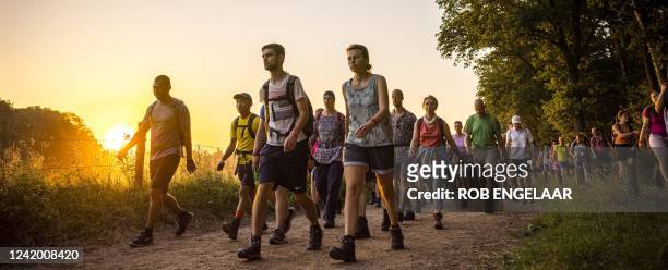 People walk during the Nijmegen Four Days Marches near Nijmegen The Netherlands, on July 20, 2022. The first walking day of the 104th Nijmegen Four...