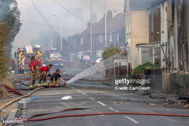 Firefighters extinguish a blaze on July 19, 2022 in Wennington, England. A series of grass fires broke out around the British capital amid an intense...