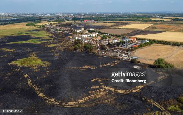 Burnt fields and houses destroyed following a major fire in Wennington, Greater London,, UK, on Wednesday, July 20, 2022. Fires broke out across...