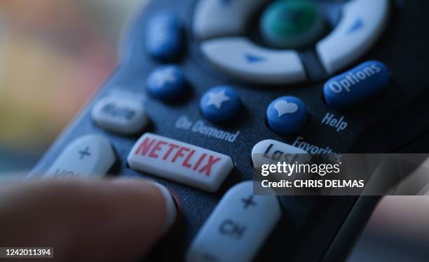 In this illustration photo taken on July 19, 2022 the Netflix logo is seen on a TV remote in Los Angeles. Netflix reported losing subscribers for the...