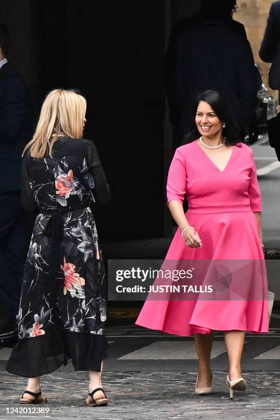 Britain's Home Secretary Priti Patel walks past member of Parliament Esther McVey as she leaves the Houses of Parliament at the end of the last...