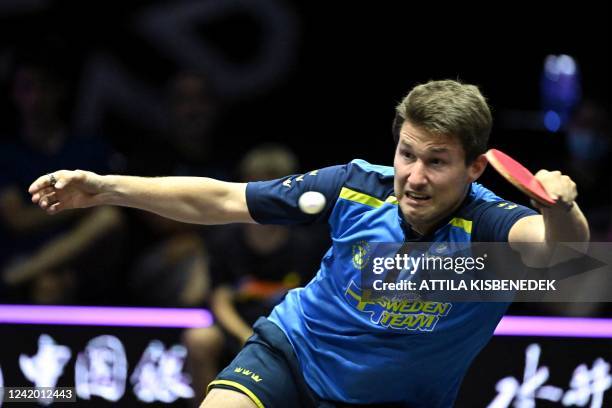 Swedens Kristian Karlsson competes against Chinas Liang Jingkun in their men's singles round of 16 match during the World Table Tennis Champions...