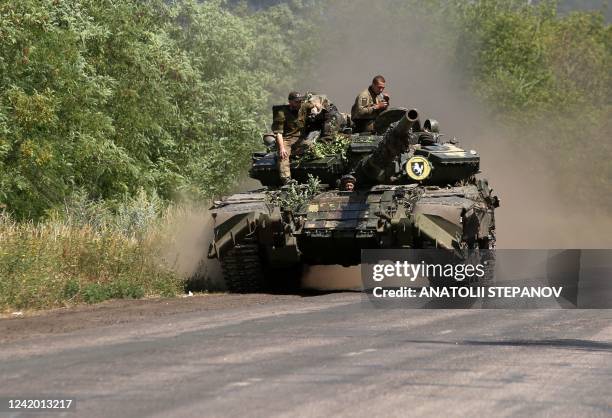 Ukrainian soldiers ride a tank on a road in the Donetsk region on July 20 near the front line between Russian and Ukrainian forces. - Russia said...