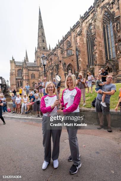 Angela Burns and Emma Hill take part in The Queen's Baton Relay as it visits Lichfield as part of the Birmingham 2022 Queens Baton Relay on July 20...