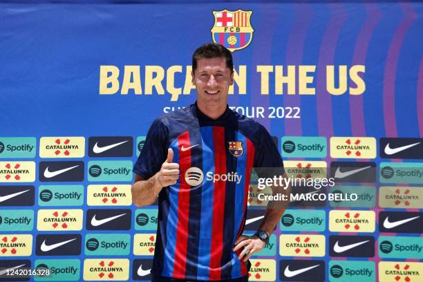 Polish football player Robert Lewandowski, gives a thumbs up during a press conference in Fort Lauderdale, Florida, on July 20 as he is introduced as...