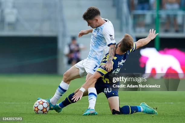 Benjamin Verbic of Dynamo Kiev fights for the ball with Ismail Yuksek of Fenerbahce during the UEFA Champions League Second Qualifying Round First...