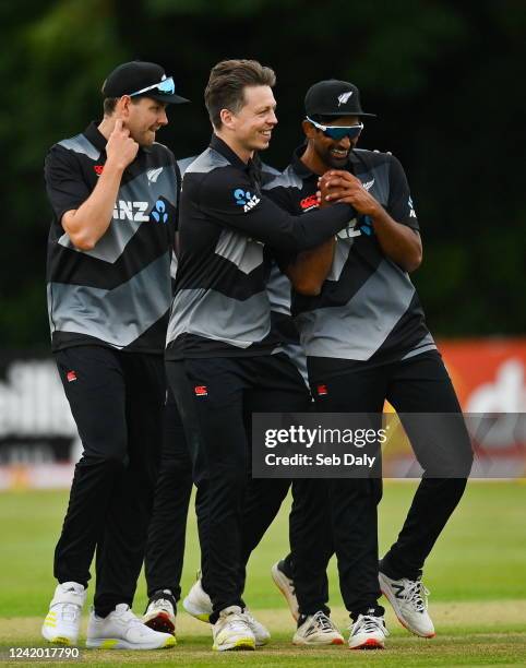 Belfast , United Kingdom - 20 July 2022; Michael Bracewell of New Zealand, centre, celebrates with teammate Ish Sodhi, right, after their side's...