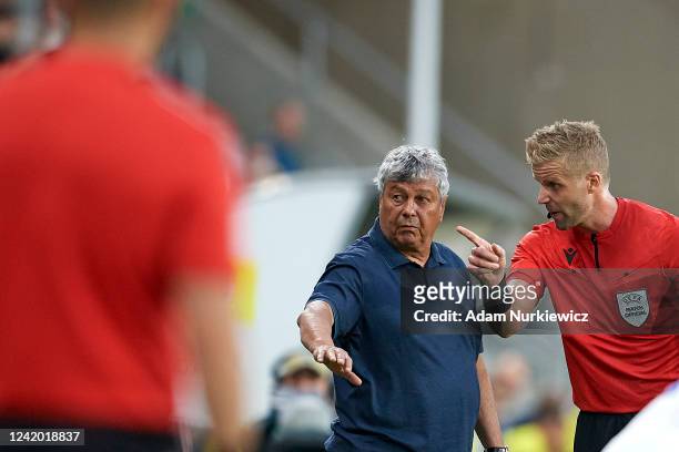Referee Glenn Nyberg from Norway talks to Mircea Lucescu Coach of Dynamo Kiev during the UEFA Champions League Second Qualifying Round First Leg...