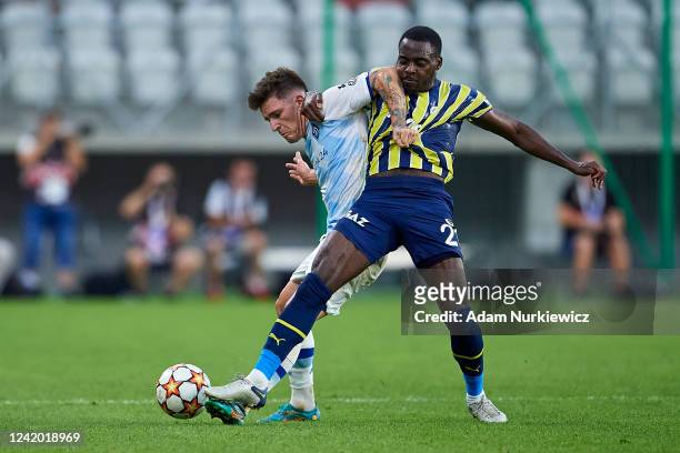 Mykola Shaparenko of Dynamo Kiev fights for the ball with Bright Osayi-Samuel of Fenerbahce during the UEFA Champions League Second Qualifying Round...