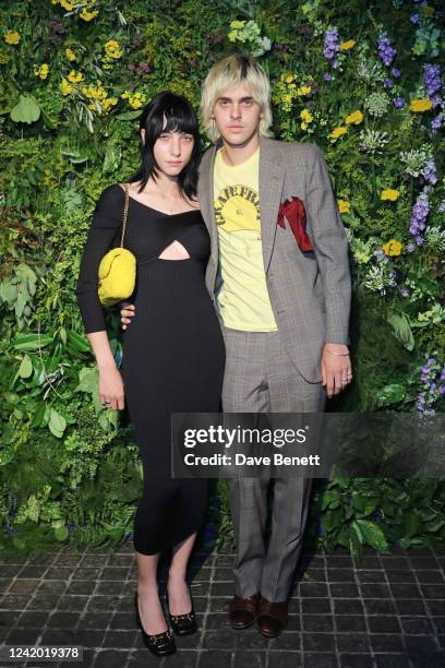 Devon Ross and Earl Cave attend the British Vogue X Self-Portrait Summer Party at Chiltern Firehouse on July 20, 2022 in London, England.
