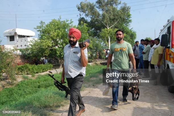 Punjab Police personnel at Hoshiar Nagar village, where two gangsters suspected to be among the shooters in singer Sidhu Moosewala's murder were...