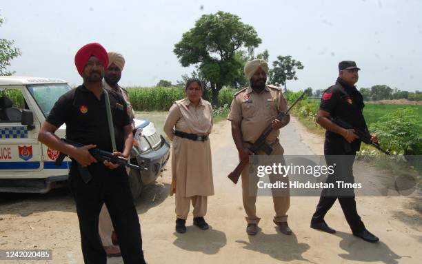 Punjab Police personnel at Hoshiar Nagar village, where two gangsters suspected to be among the shooters in singer Sidhu Moosewala's murder were...