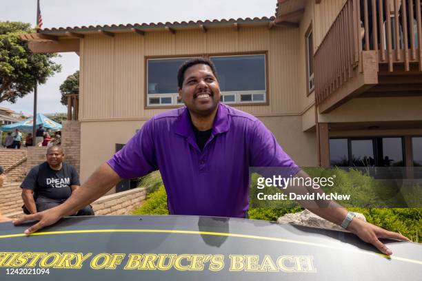 Anthony Bruce is seen posing for a photo at a plaque commemorating the history of Bruces Beach after a ceremony to return ownership of Bruce's Beach...