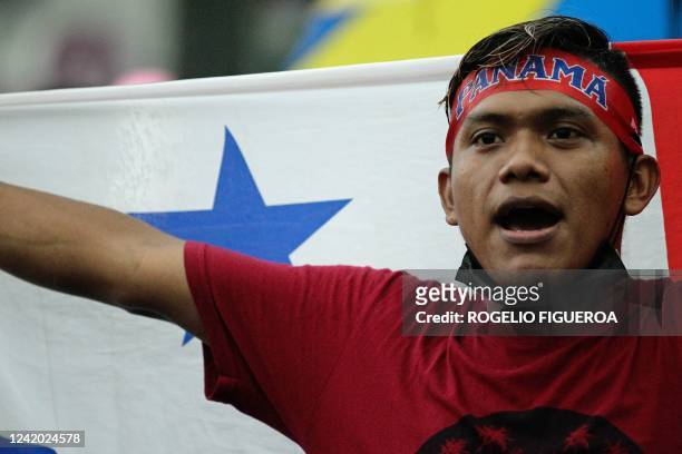 Demonstrator with a Panamanian flag takes part in a protest against the high cost of food and gasoline in Panama City, on July 20, 2022. - Fresh...