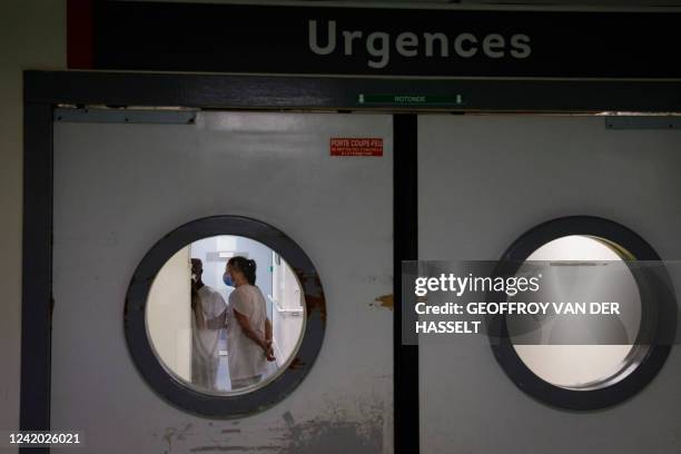 Caregivers look on inside the emergency department of the Quatres villes hospital in Saint-Cloud, west of Paris, on July 20, 2022. In a suburb of...