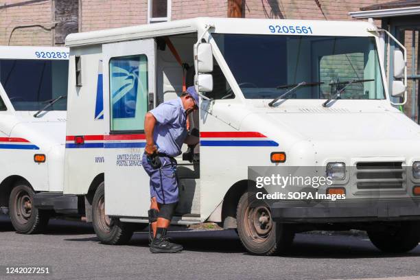 United States Postal Service worker exits a Grumman Long Life Vehicle. On July 20, the USPS announced that at least 40 percent of its Next Generation...