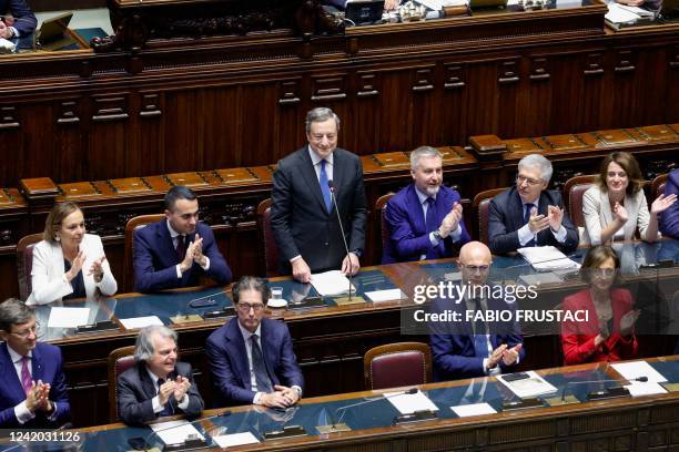 Italy's Prime Minister Mario Draghi stands up as Italian Interior Minister Luciana Lamorgese , Foreign Minister Luigi Di Maio and Italian Defence...