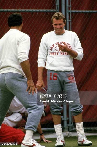 San Francisco 49ers Joe Montana talks with teammates during practice at Red Morton Park. Redwood City, CA CREDIT: Mickey Pfleger