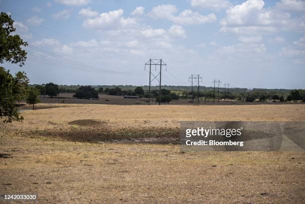 Dried up pond on a farm during a heatwave in outside, Smithville, Texas, US, on Wednesday, July 20, 2022. In Texas 100-degree Fahrenheit temperatures...