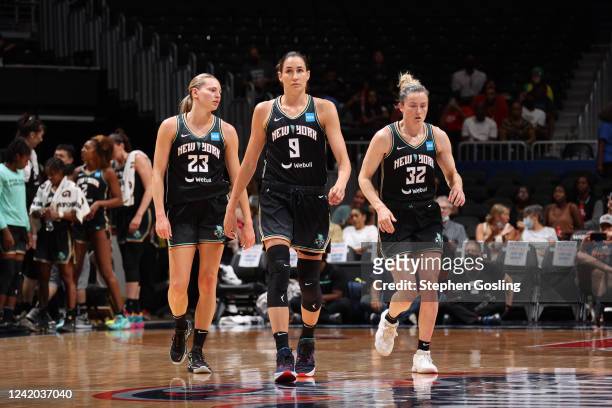 Marine Johannès, Rebecca Allen and Sami Whitcomb of the New York Liberty look on during the game against the Washington Mystics on July 21, 2022 at...