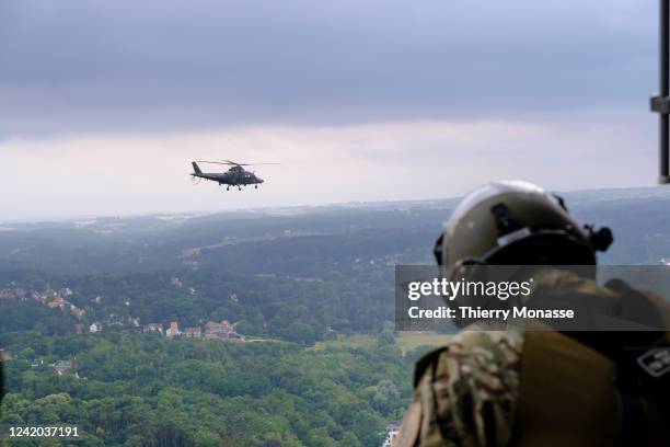 Belgium soldier is seen looking at an Agusta Helicopter from a NHIndustries NH90 during the parade for the Belgium National Day on July 21, 2022 in...