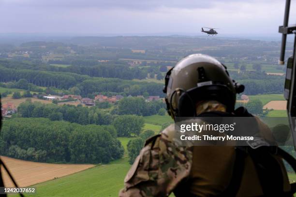 Belgium soldier is seen looking at an Agusta Helicopter from a NHIndustries NH90 during the parade for the Belgium National Day on July 21, 2022 in...