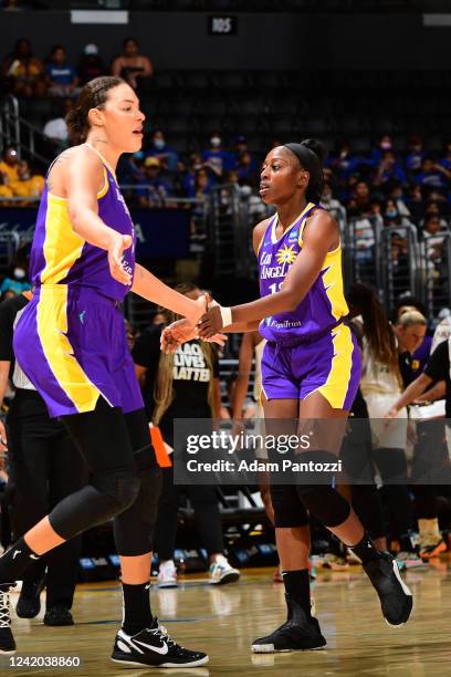 Liz Cambage of the Los Angeles Sparks high fives Chiney Ogwumike during the game against the Atlanta Dream on July 21, 2022 at Crypto.com Arena in...