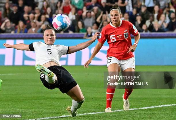 Germany's defender Marina Hegering is challenged by Austria's striker Nicole Billa during the UEFA Women's Euro 2022 quarter final football match...