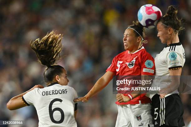 Germany's defender Marina Hegering and Austria's midfielder Annabel Schasching vie for a header nex to Germany's midfielder Lena Oberdorf during the...