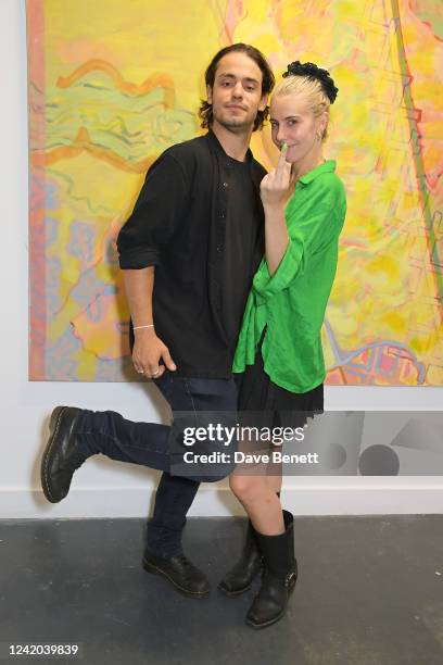 Beto Distassi and India Rose James attend a private view of "Through The Portal" by artists Coco Morris and Clare Davidson at Soho Revue on July 21,...