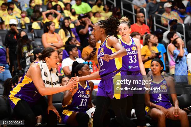 Liz Cambage of the Los Angeles Sparks high fives Nneka Ogwumike during the game against the Atlanta Dream on July 21, 2022 at Crypto.com Arena in Los...