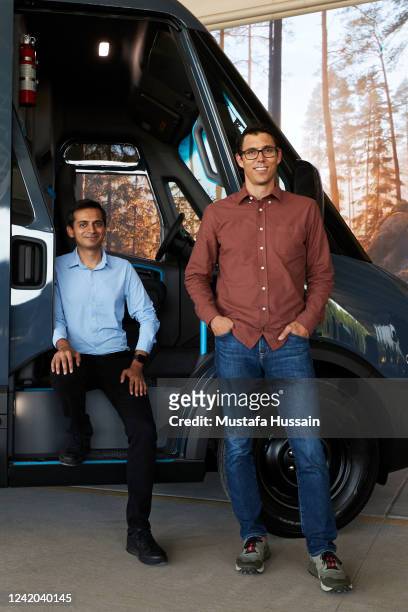 Founder and CEO of Rivian RJ Scaringe and Amazon Vice President of Transportation Udit Madan, pose with an Electric Delivery Vehicle , during a...