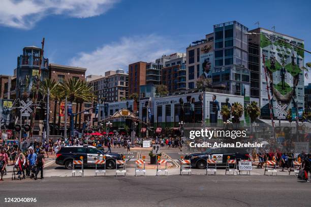 People walk in downtown near the San Diego Convention Center during Comic-Con on July 21, 2022 in San Diego, California. After two years of virtual...