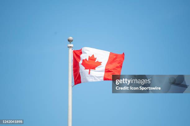 The national flag of Canada waves in the wind during the Infosys Hall of Fame Open on July 15 at the International Tennis Hall of Fame in Newport, RI.