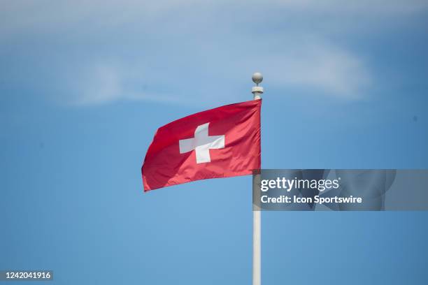 The flag of Switzerland waves in the wind during the Infosys Hall of Fame Open on July 15 at the International Tennis Hall of Fame in Newport, RI.