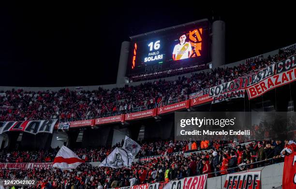 The screen shows Pablo Solari of River Plate as fans of River Plate cheer for their team before a match between River Plate and Gimnasia y Esgrima La...