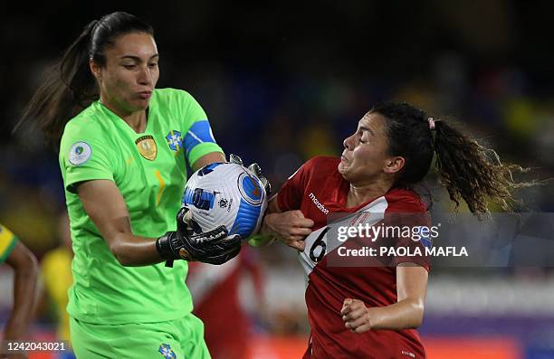 Brazil's goalkeeper Lorena (L9 and Peru's Claudia Cagnina vie for the ball during their Conmebol 2022 women's Copa America football tournament match...
