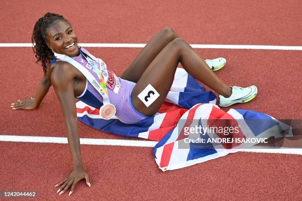 Bronze medallist Britain's Dina Asher-Smith celebrates after the women's 200m during the World Athletics Championships in Eugene, Oregon on July 21,...