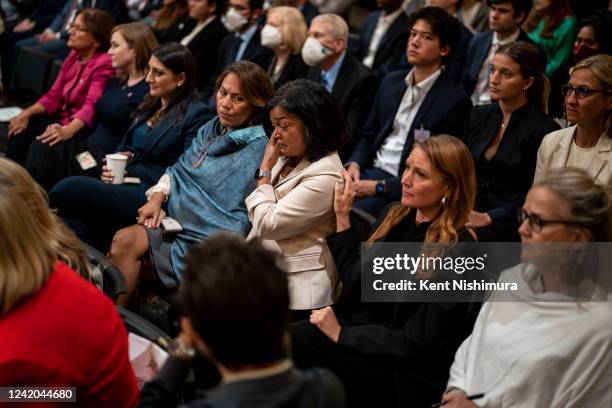 Rep. Pramila Jayapal wipes tears away after seeing footage of herself on January 6, 2021 in the House Chamber is seen on screen during a hearing of...