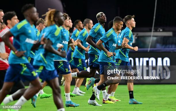 Juventus new signing French player Paul Pogba joins his teammates for a training session on the pitch at Allegiant Stadium in Las Vegas, Nevada on...