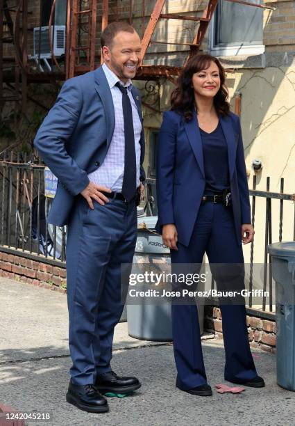 Donnie Wahlberg and Marisa Ramirez are seen on the set of "Blue Bloods" on July 21, 2022 in New York City.