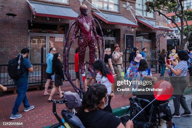 People walk in downtown near the San Diego Convention Center where Comic Con is being held on July 21, 2022 in San Diego, California.