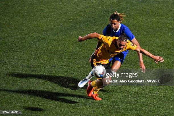 Tyler Roberts of Wolverhampton Wanderers FC U21 drives into Oliver Tipton of Chelsea FC U21 during a game at Zions Bank Stadium on July 21, 2022 in...
