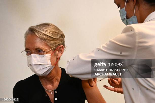 French Prime Minister Elisabeth Borne receives a booster vaccination dose against Covid-19 in Paris, on July 22, 2022.