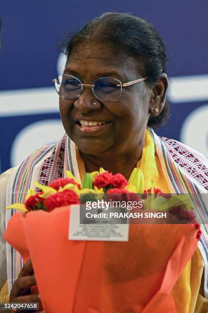India's President elect Droupadi Murmu attends an event at her temporary residence after she was elected as country's new president in New Delhi on...
