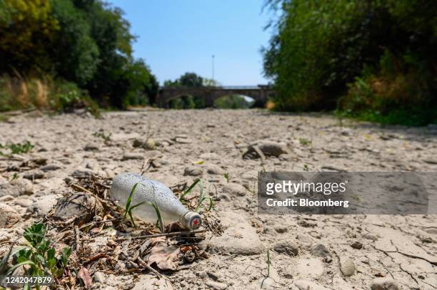 Dry mud on the bed of the Sangone river in Beinasco, Italy, on Thursday, July 21, 2022. As drier-than-usual conditions and an early summer heat wave...