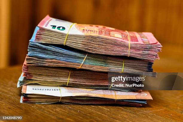 Bills of 5 20, 50 euros piled up. Illustration pictures of bills and coins in euro. Cours-la-Ville, July 21 2022.