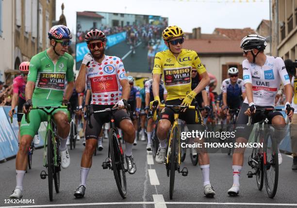 Jumbo-Visma team's Belgian rider Wout Van Aert wearing the sprinter's green jersey , Cofidis team's German rider Simon Geschke wearing the climber's...